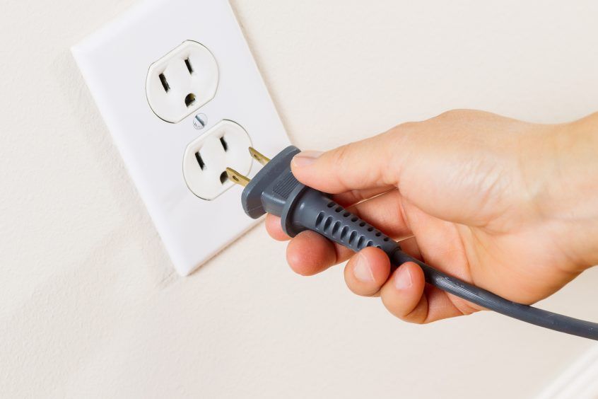 Inserting a plug into an outlet