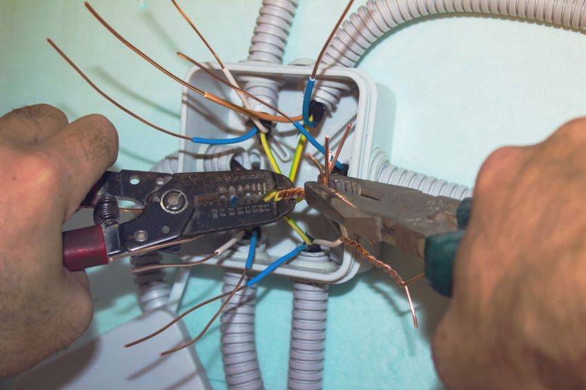 Electrician working on wiring