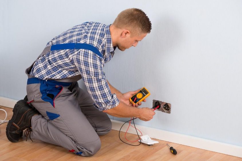 Electrician doing electrical maintenance