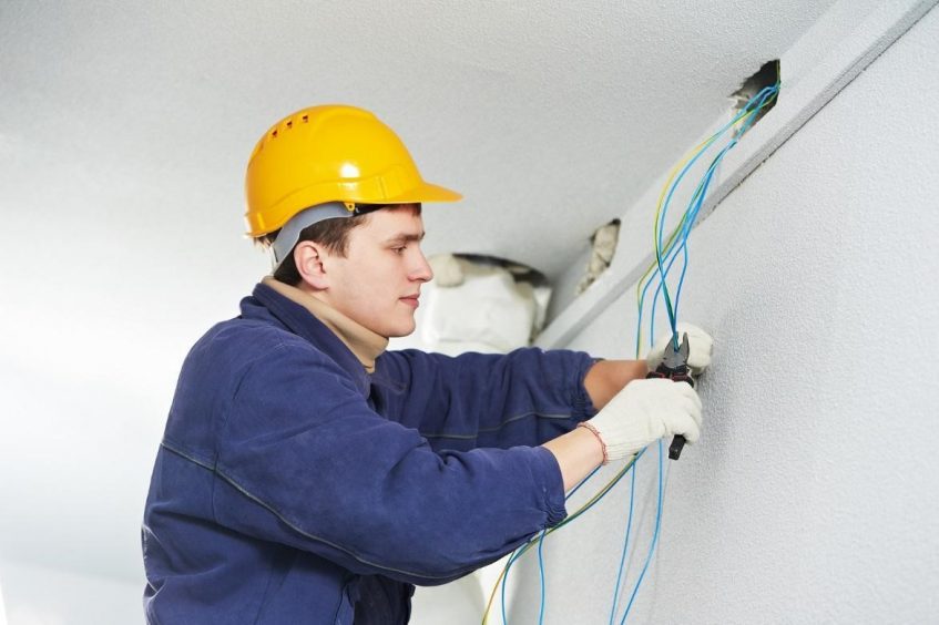 Electrician working on wiring