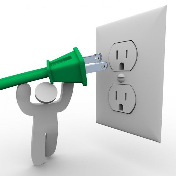 Stick figure man carrying plug into electrical outlet